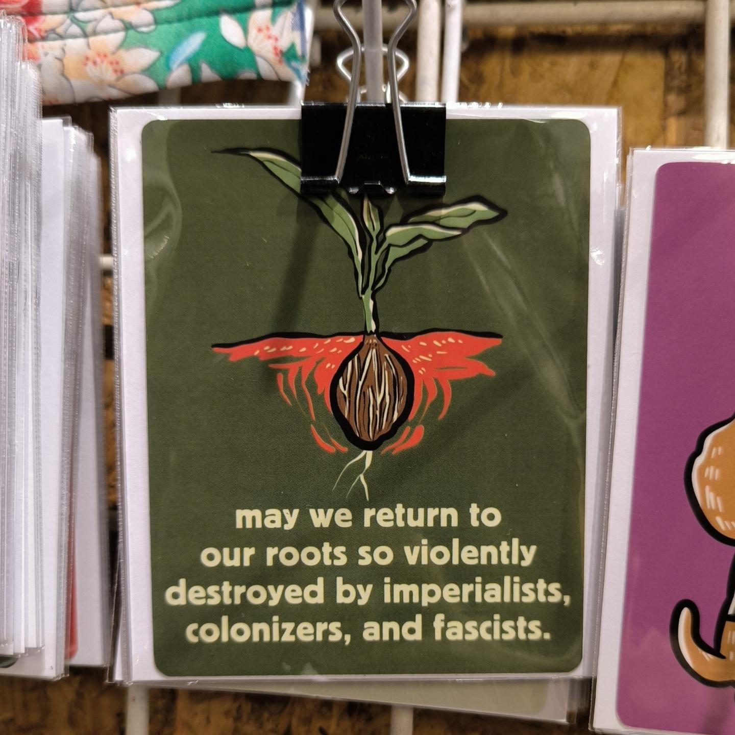 a sticker that says: may we return to our roots so violently destroyed by imperialists colonizers and fascists