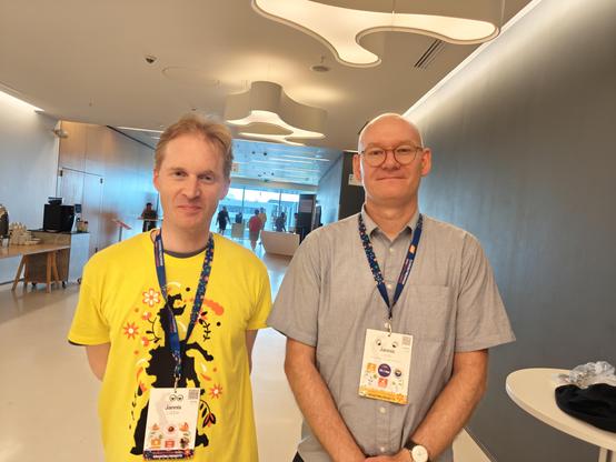 Two white men with name tags that read Jannis